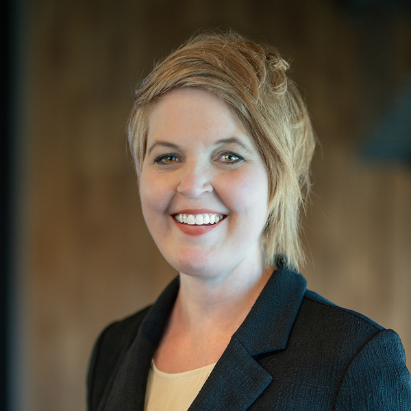 Krista Kruitoff, Memory Care Director at The Boulevard Wentzville Senior Living, smiling in a professional indoor headshot while wearing a dark blazer and light blouse.
